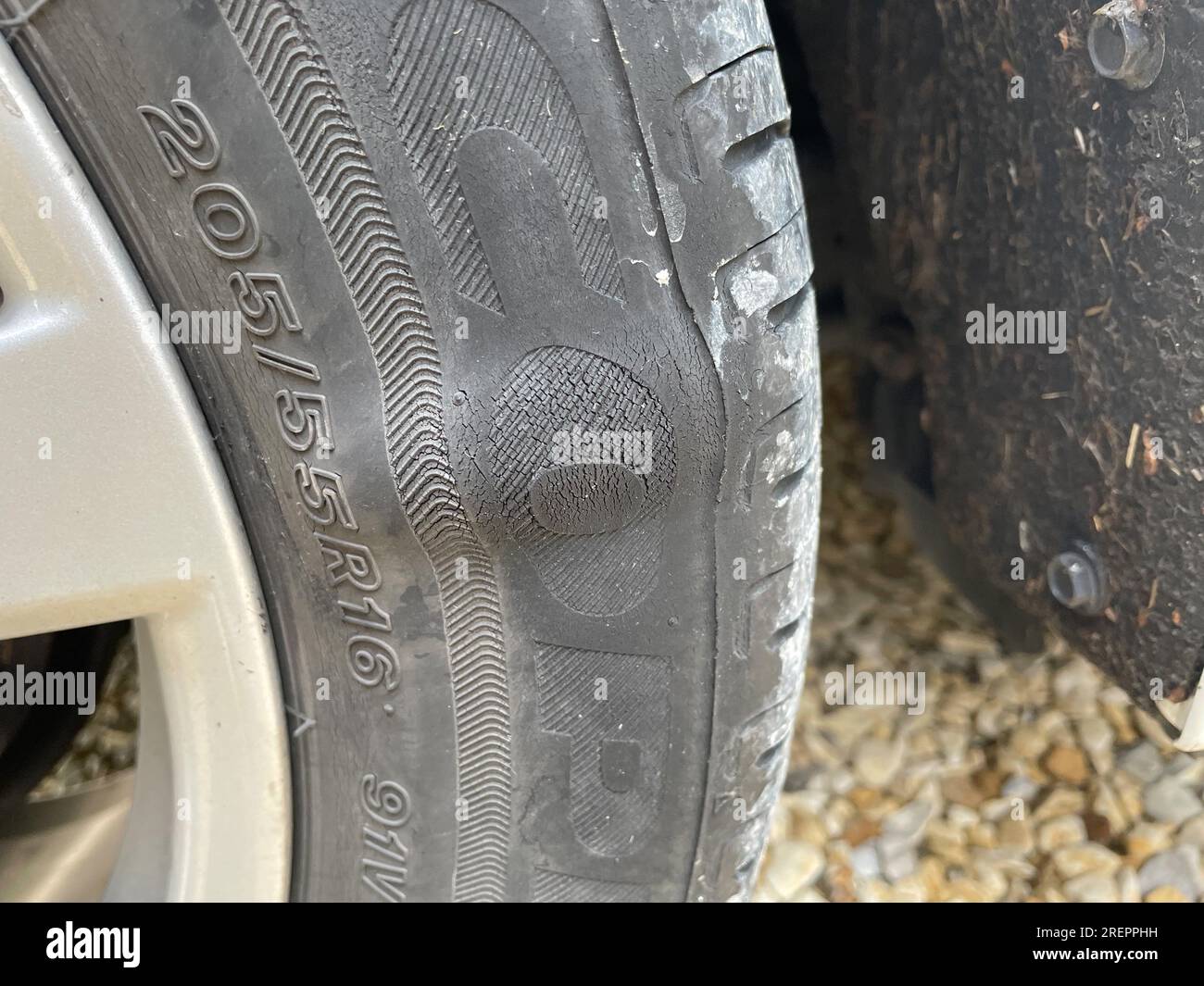 Newcastle UK: 8th July 2023: close-up of a damaged car tyre with a large bulge and persihed rubber Stock Photo