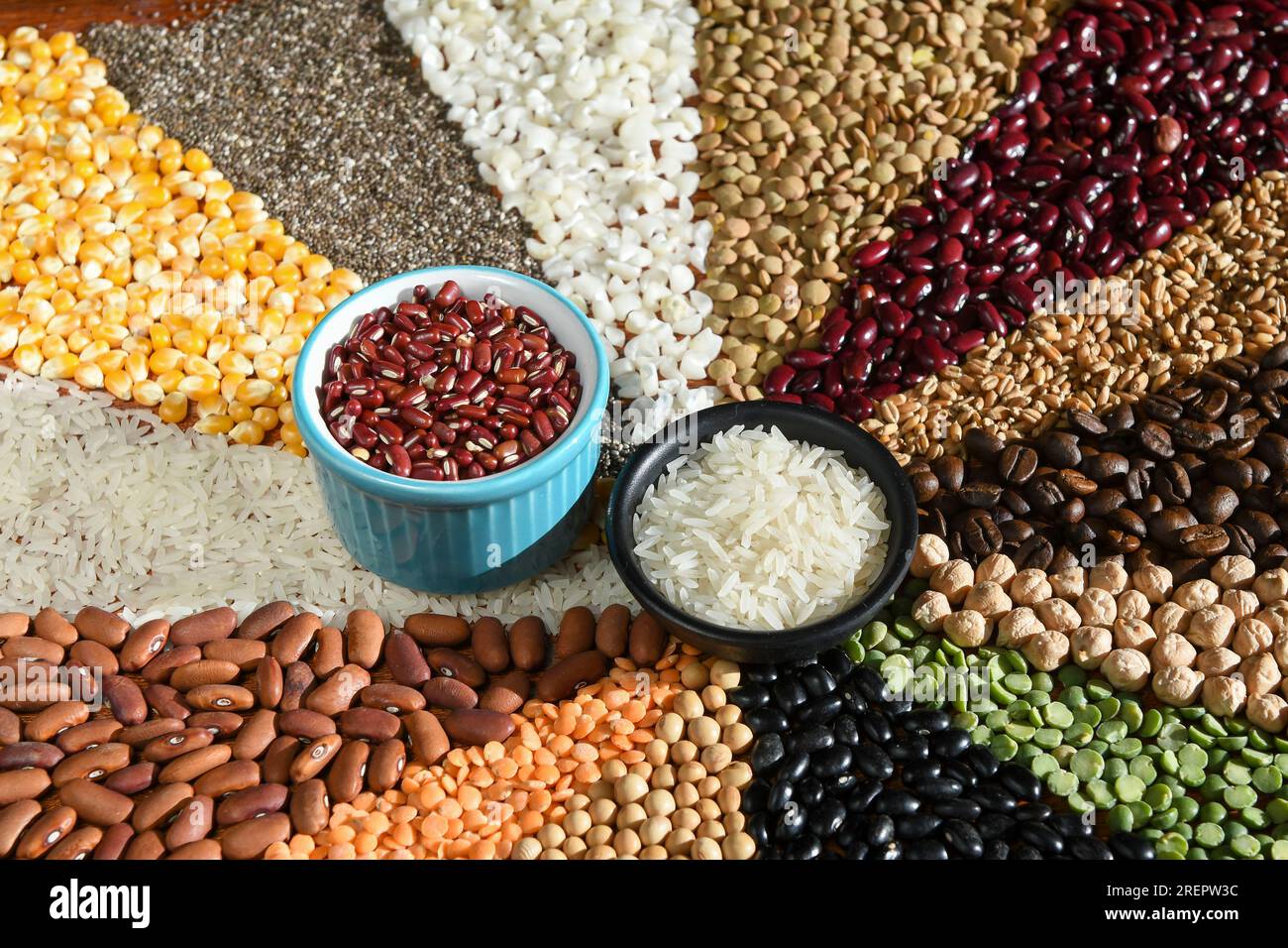 Raw Rice Beans Bowl with raw white rices and beans on various seeds Stock Photo - Alamy