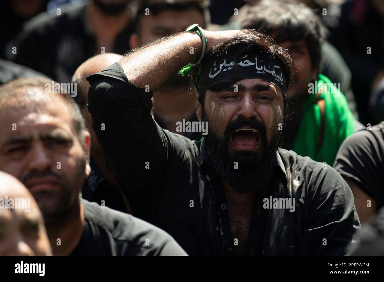 A Shiite Muslim reacts during a procession to mark Ashoura, in the port ...
