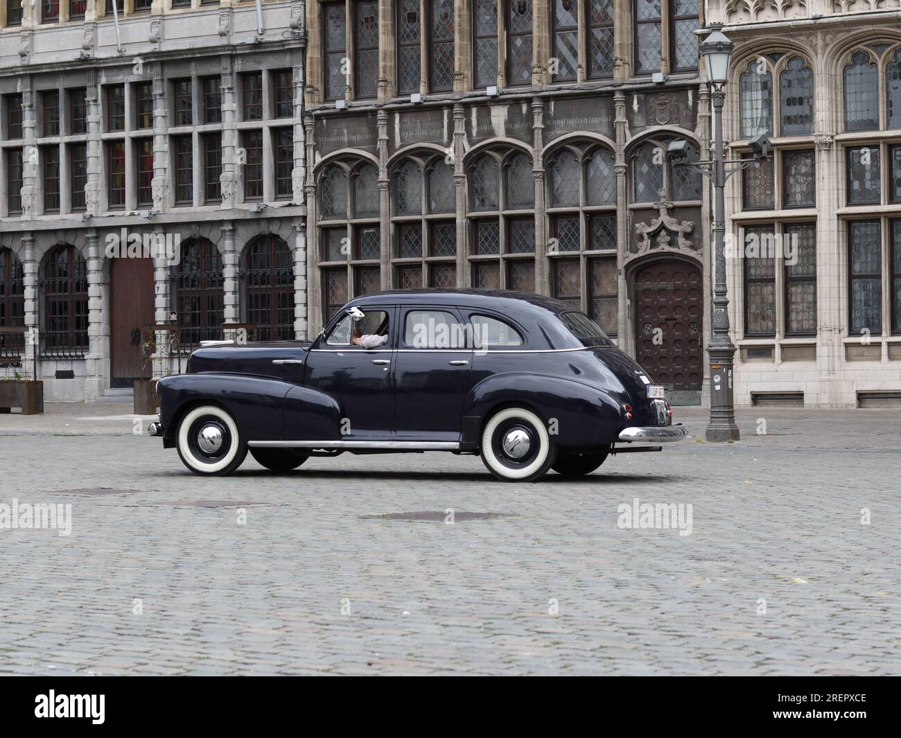 1940 Packard 110 Club Coupe driving in the Grote Markt in Antwerp, Belgium Stock Photo