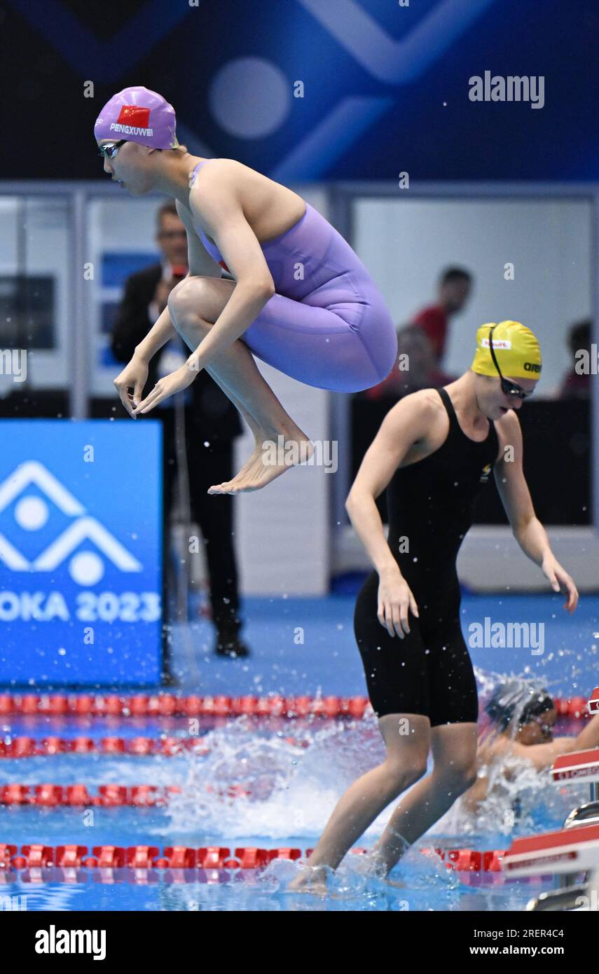 Fukuoka, Japan. 29th July, 2023. Peng Xuwei (L) of China jumps into
