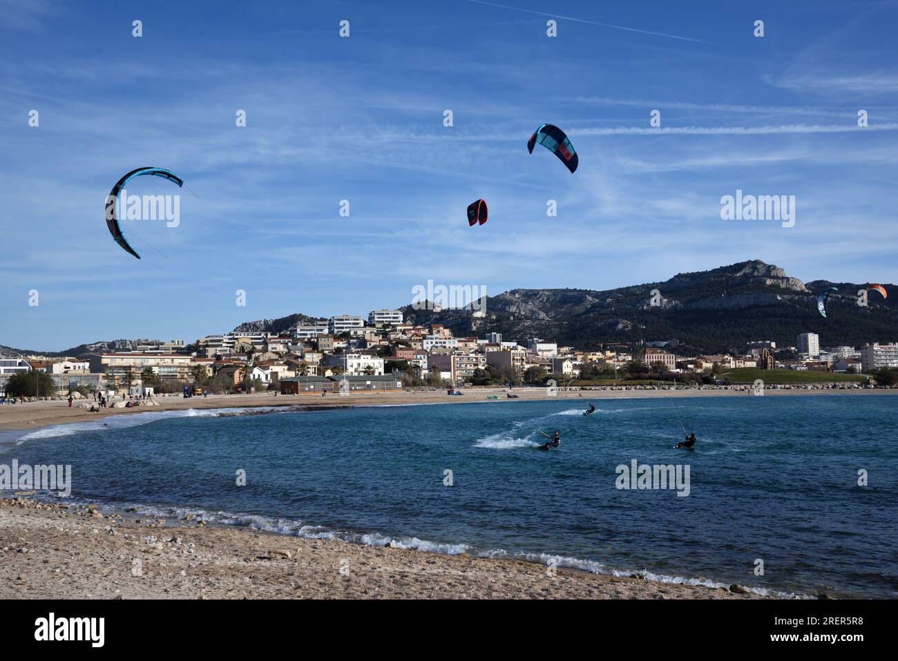 Kiteboarder, Kiteboarders, Kiteboarding or Kitesurfing off Prado Beach on Mediterranean Coast Marseille France Stock Photo