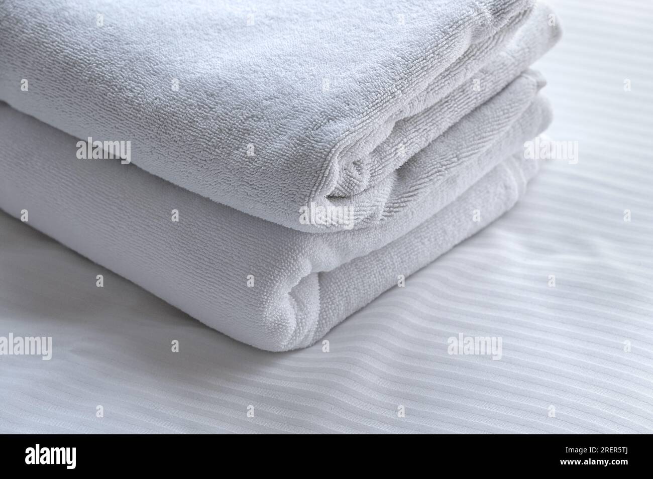 clean white towels on the hotel bed. feels cozy, comfort and relax