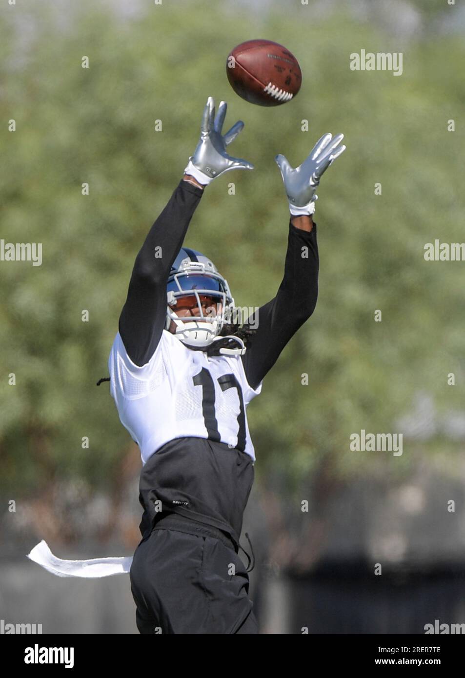 Las Vegas Raiders wide receiver Davante Adams (17) leaps for a