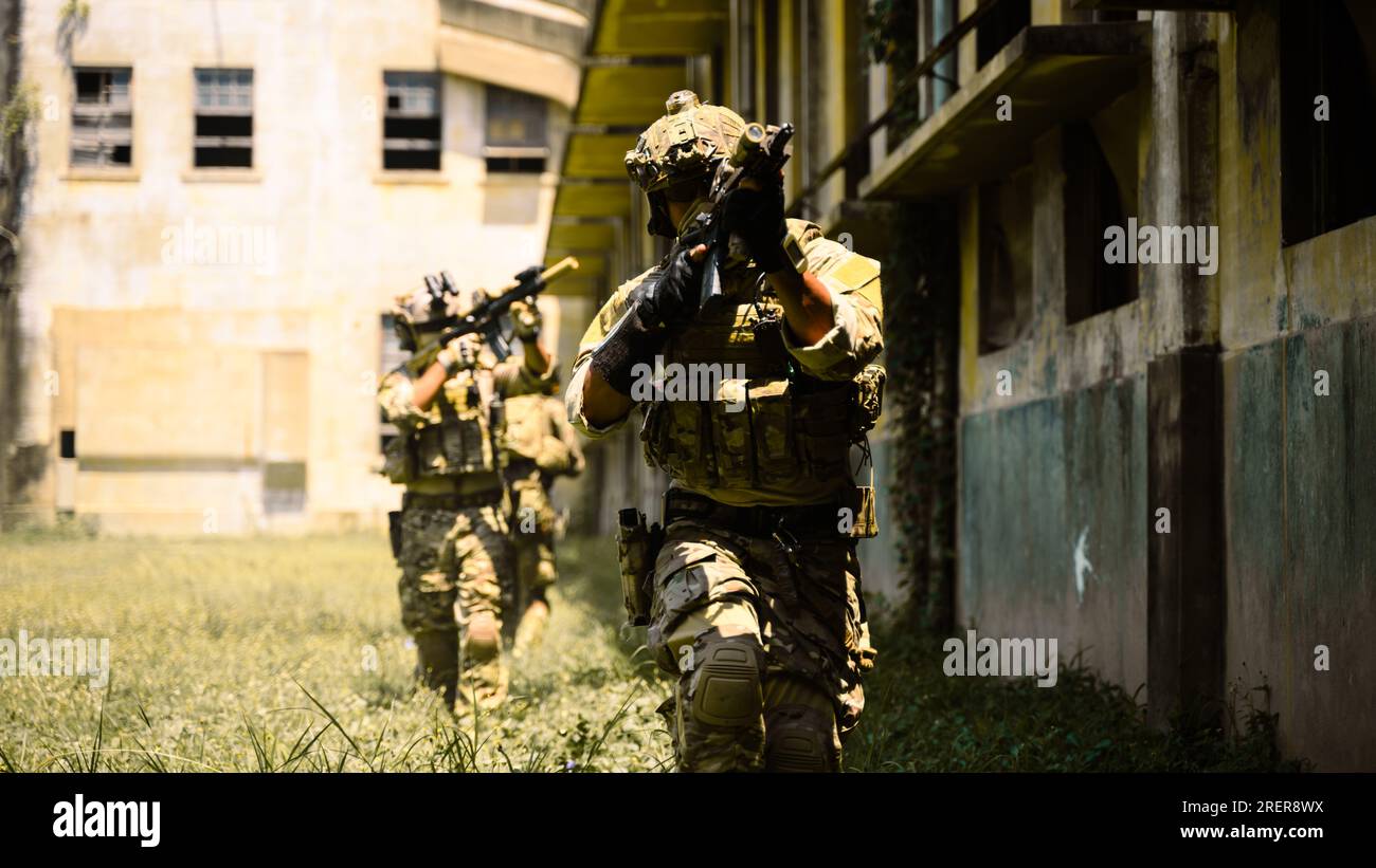 Squad of soldiers running forward and attacking enemy during military