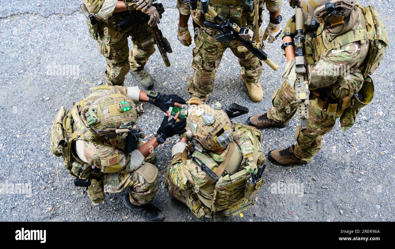 Smart teamwork of soldiers running forward and attacking enemy during ...