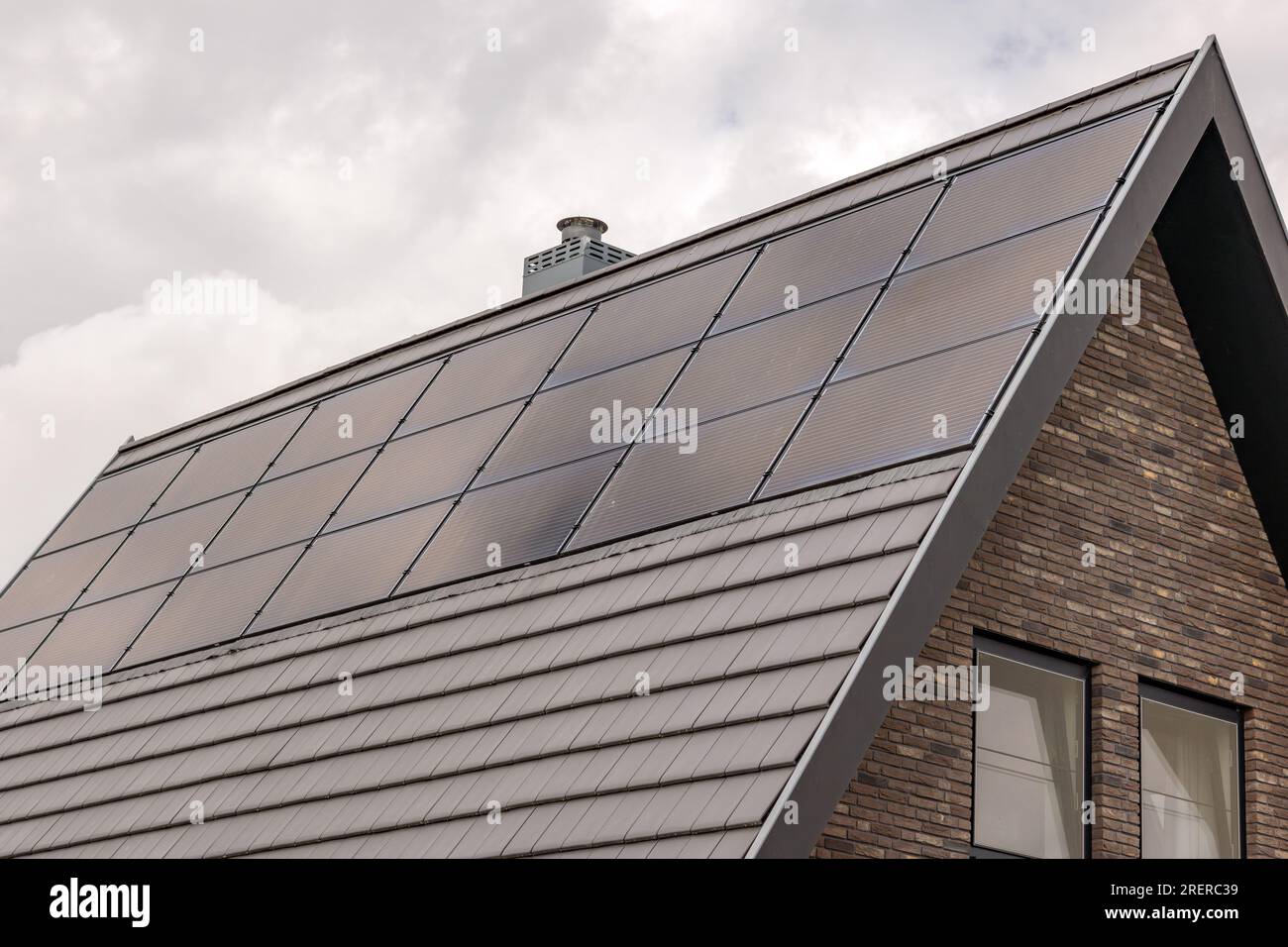 modern detached house with solar panels in the roof Stock Photo Alamy