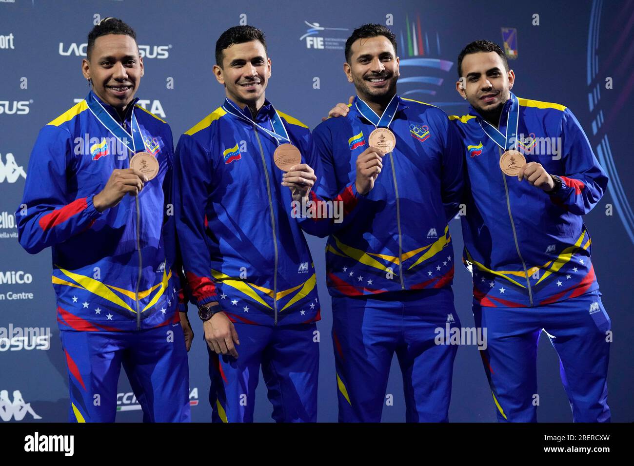 Venezuela's team celebrate on the podium their bronze medal in the men