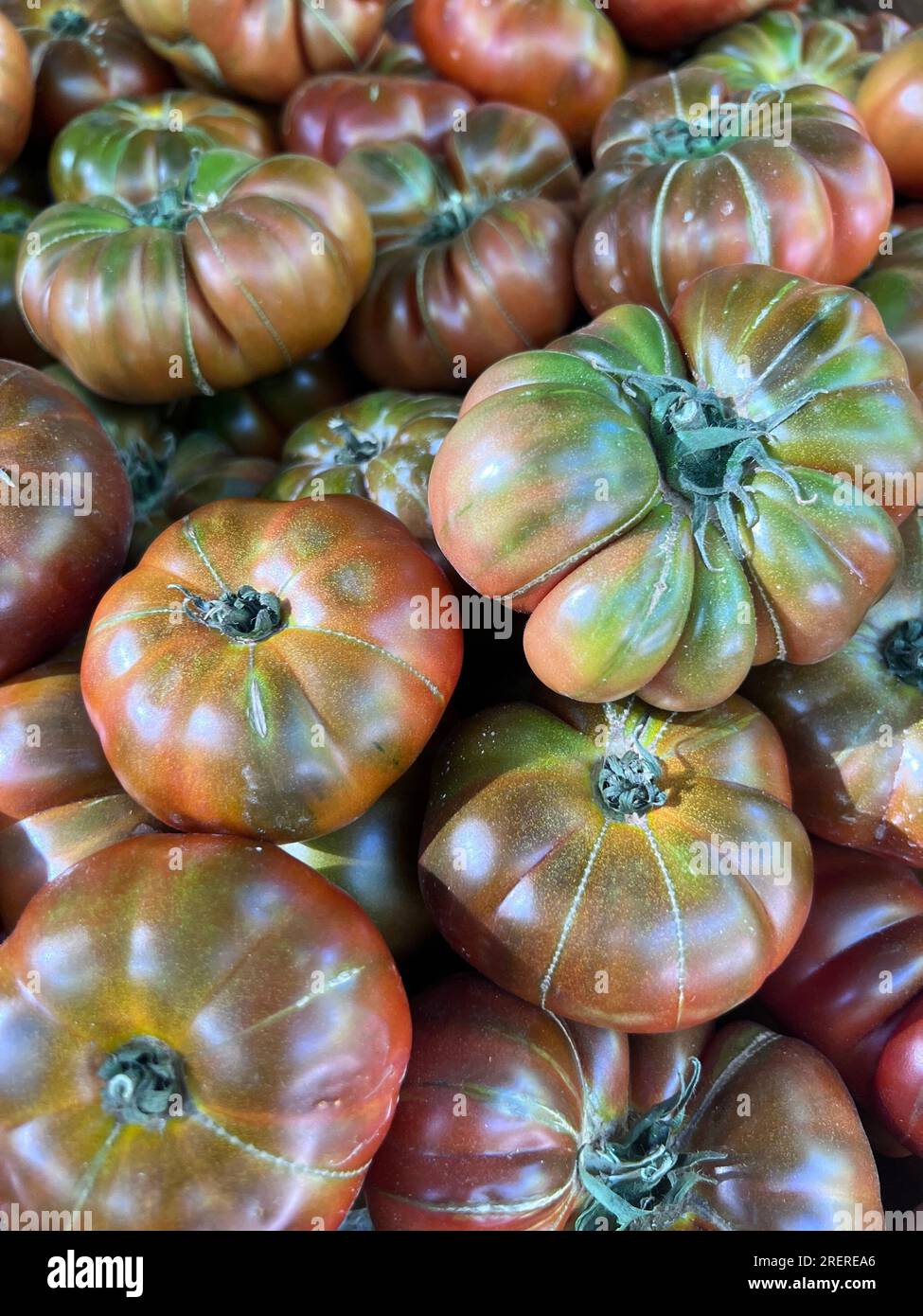 tomatoes displayed in the market for sale Stock Photo