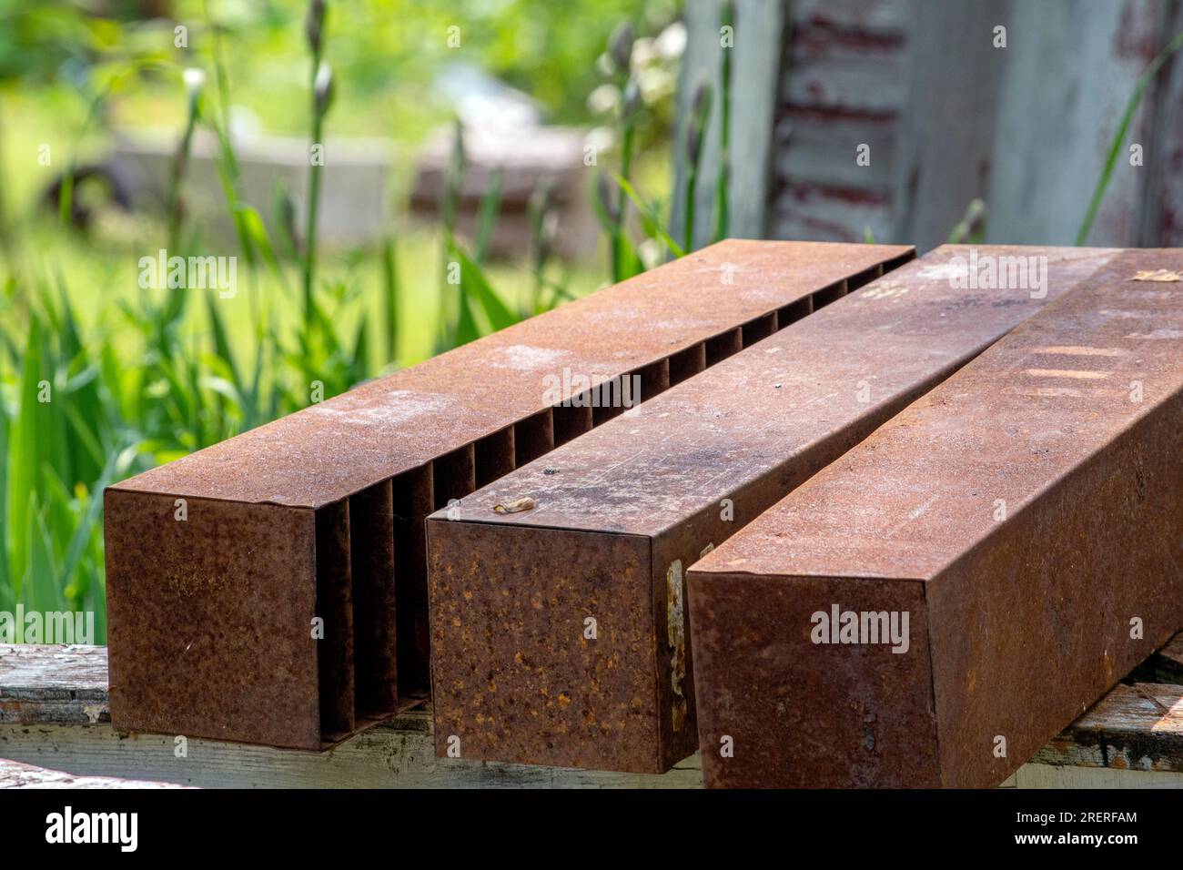 large steel posts on a wood table Stock Photo