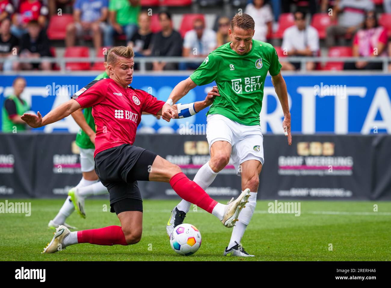 Taunusstein Wehen, Germany. 22nd July, 2023. TAUNUSSTEIN-WEHEN, GERMANY - JULY 22: Paul Gladon of Fortuna Sittard battles for the ball with Florian Carstens of Wehen Wiesbaden during the Pre-Season Friendly match between SV Wehen Wiesbaden and Fortuna Sittard at the BRITA-Arena on July 22, 2023 in Taunusstein-Wehen, Germany (Photo by Orange Pictures) Credit: Orange Pics BV/Alamy Live News Stock Photo