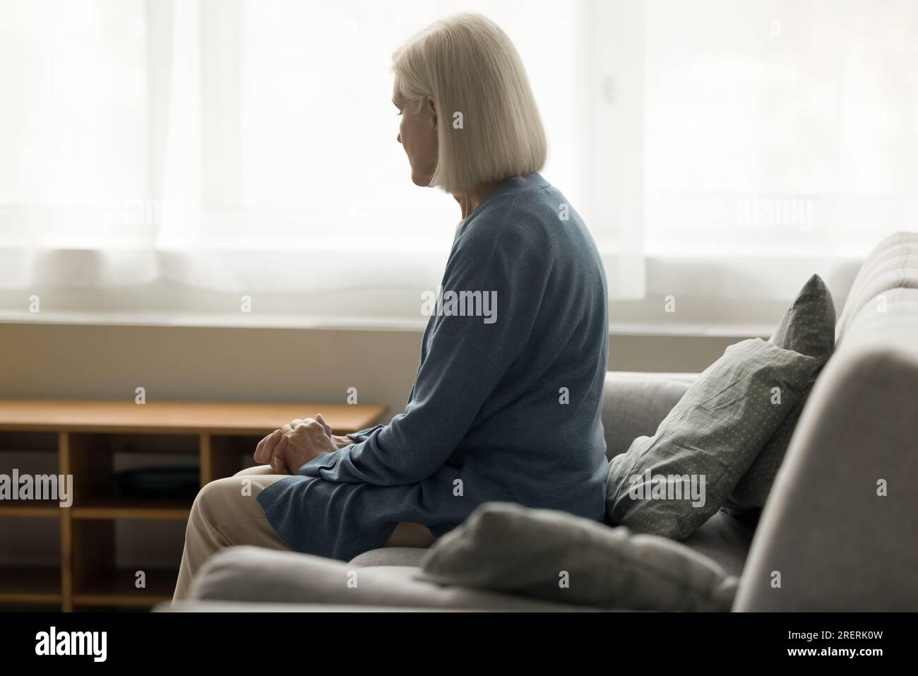 Mature woman home sofa hi-res stock photography and images - Alamy