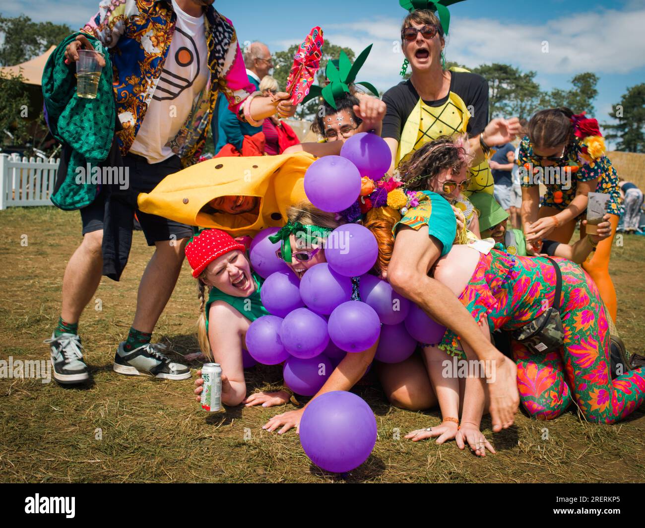 WOMAD Festival, Charlton Park, England, UK. 29th July, 2023. Revellers enjoy the festival atmosphere despite the occasional rain downpours. Credit: Andrew Walmsley/Alamy Live News Stock Photo