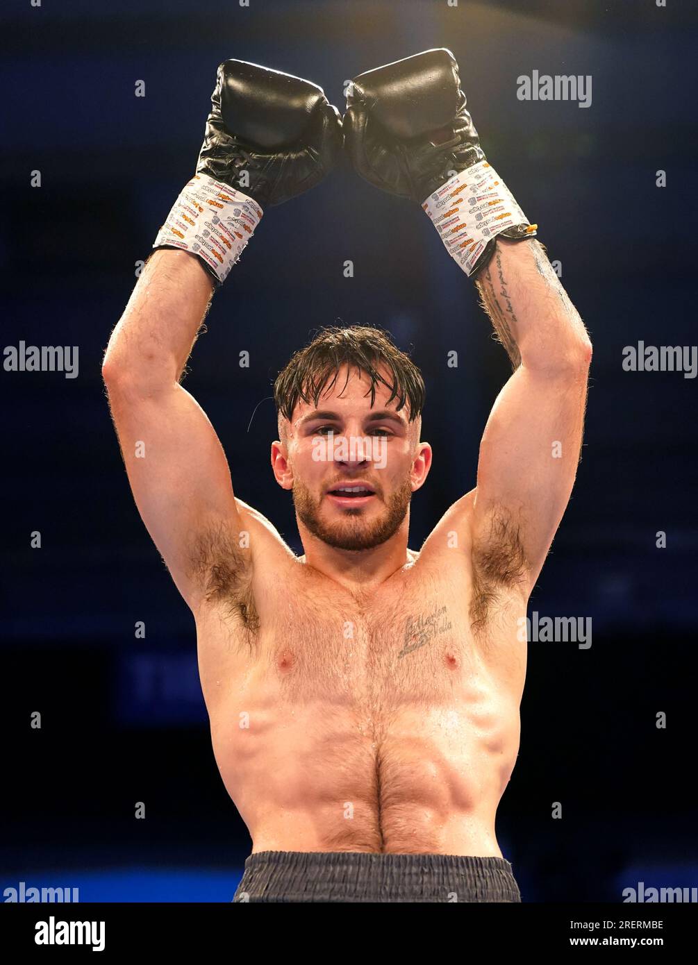 Owen Cooper celebrates victory against Robin Zamora (not pictured) in the welter weight bout at the Telford International Centre, Telford. Stock Photo