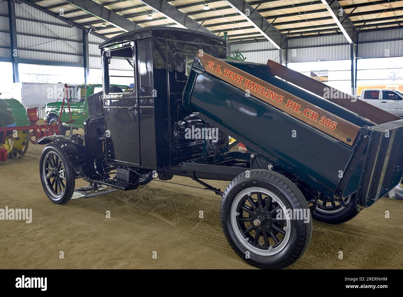A restored, black, antique dump truck on display at the 2023 Delaware State Fair, in Harrington, Delaware USA. Stock Photo