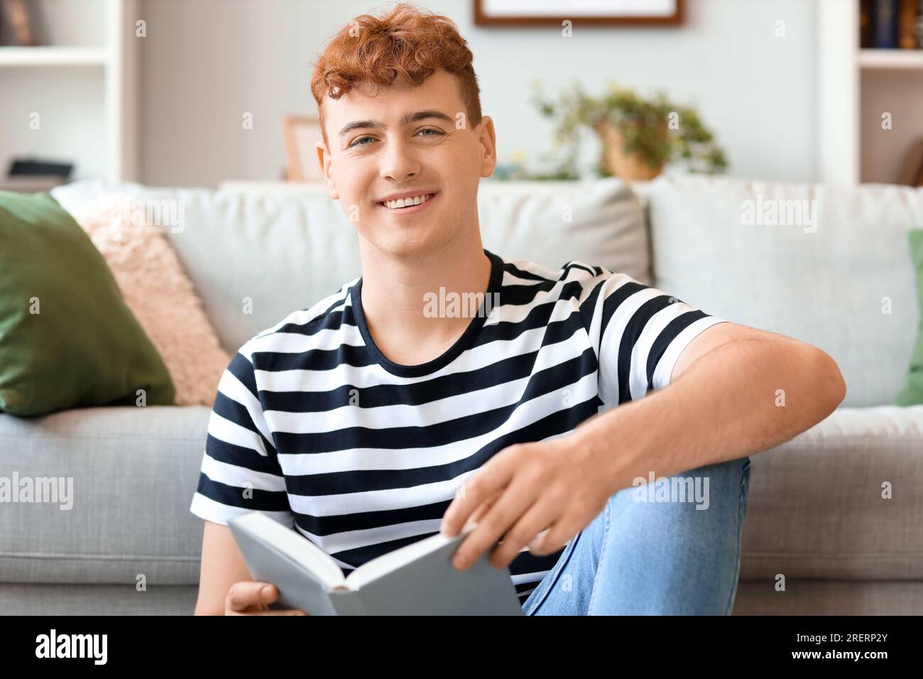 Young redhead man reading hi-res stock photography and images - Alamy