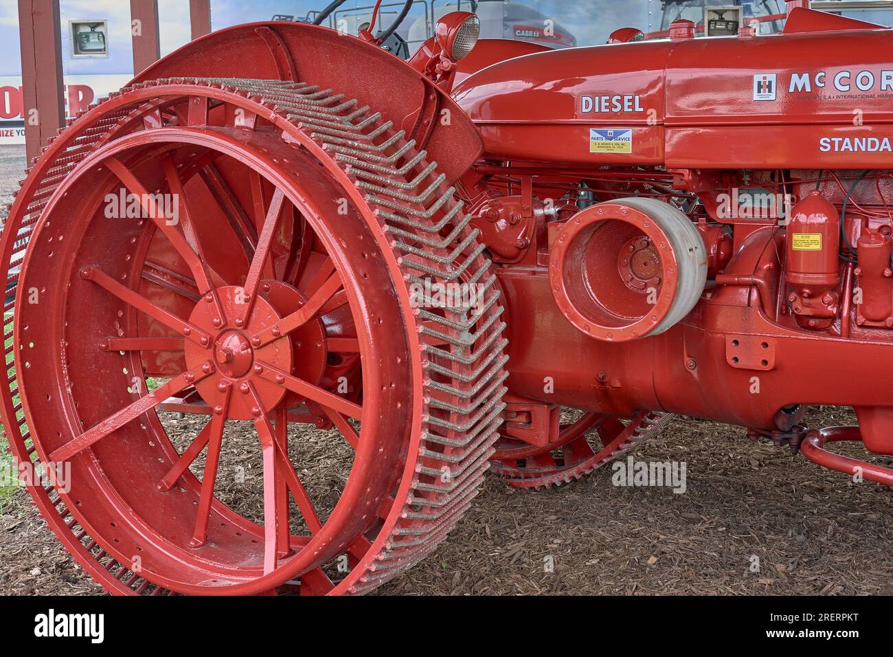 Restored red McCormick diesel antique farm tractor at the 2023 Delaware State Fair in Harrington, Delaware USA. Stock Photo