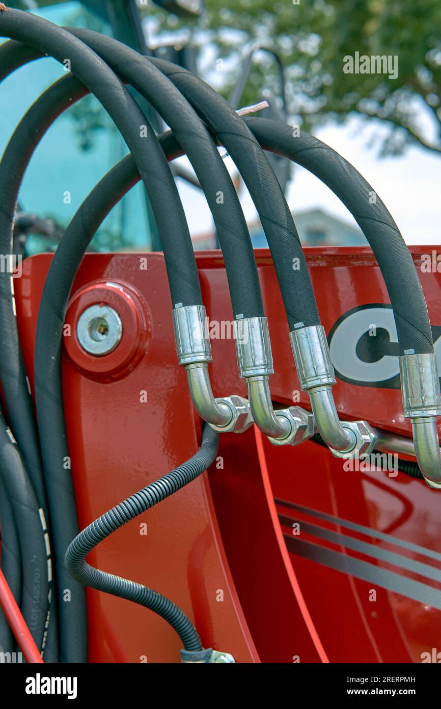 Hydraulic lines and connectors on a modern farm tractor. Stock Photo