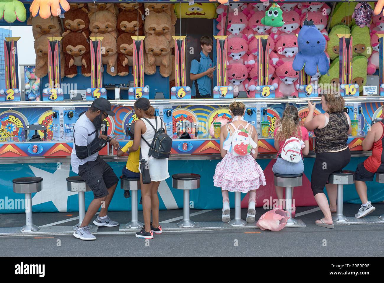 a Fair goer in fancy costume at a midway amusement in the 2023 Delaware State Fair, Harrington, Delaware USA. Stock Photo