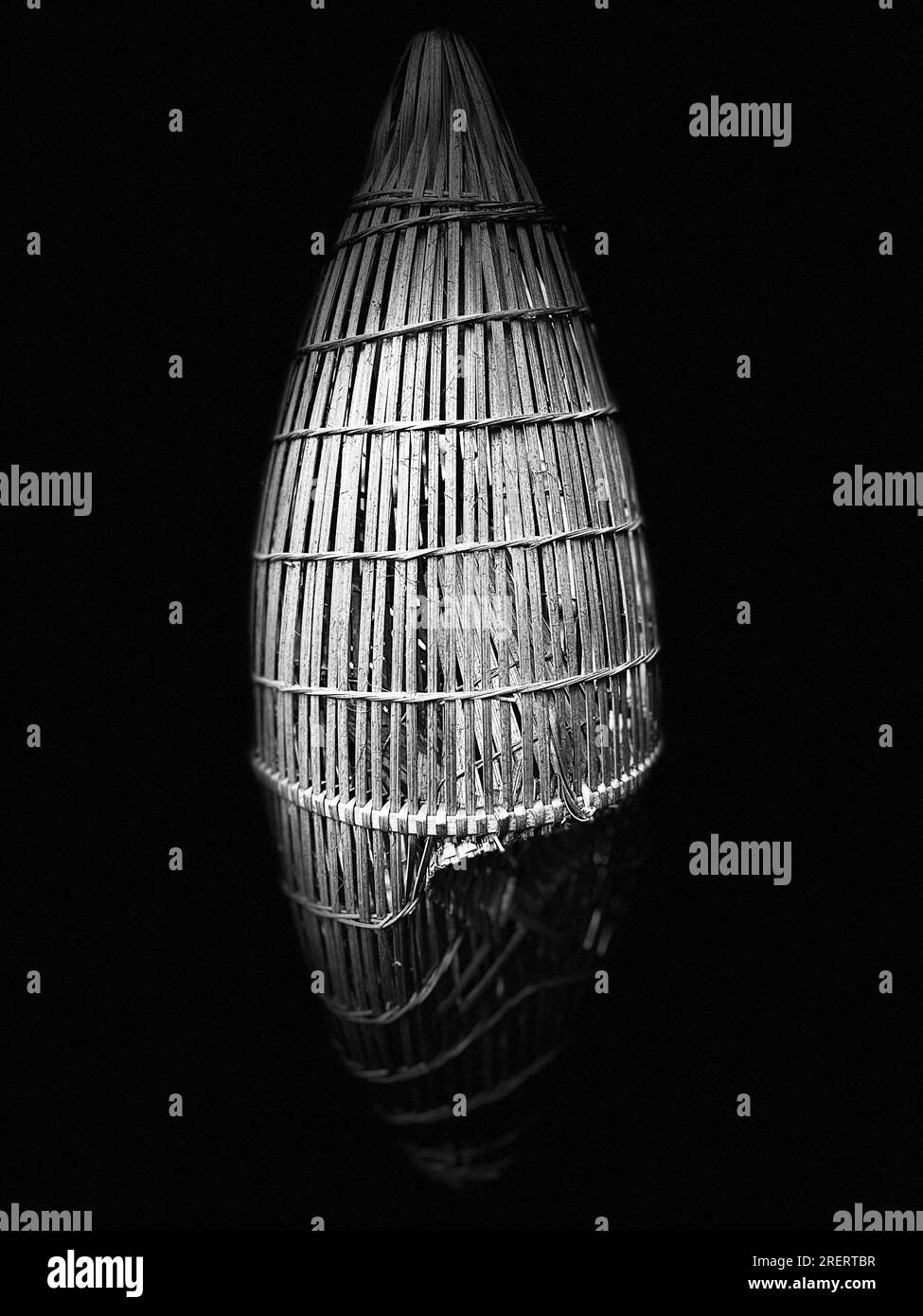 Black and white still life of an ancient Vietnamese bamboo fish trap Stock Photo