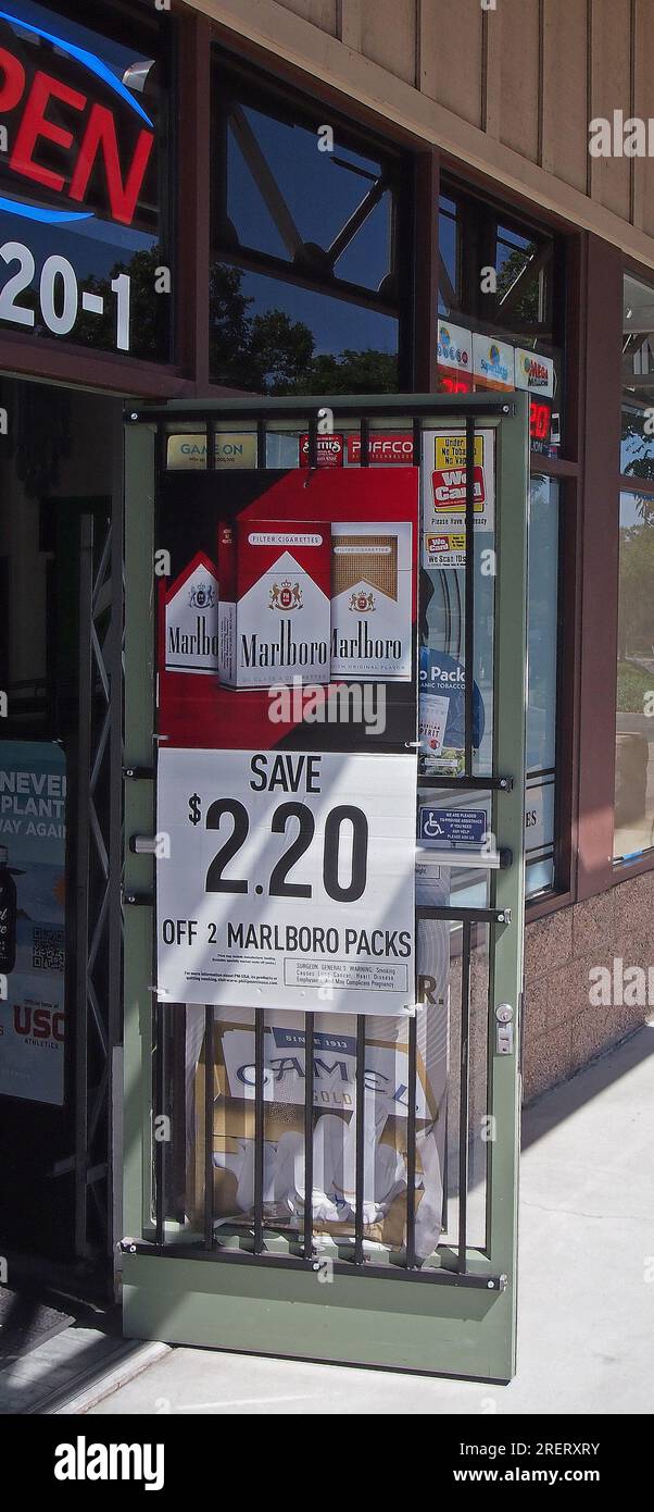 a smoke shop entrance door with Marlboro cigarettes sign in California