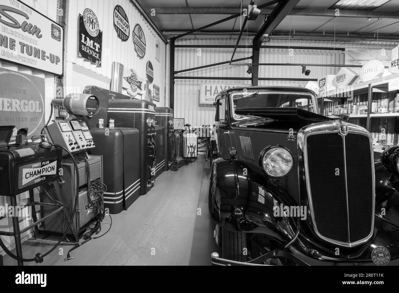 Sparkford.Somerset.United Kingdom.March 26th 2023.A 1938 Morris Eight Saloon is on show in an old fashioned garage a the Haynes Motor Museum in Somers Stock Photo