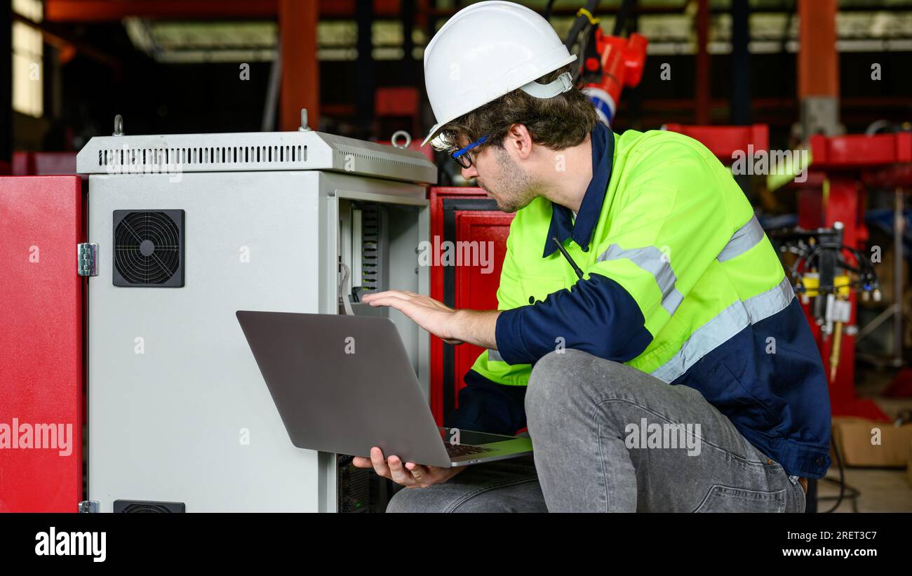 Engineer foreman checking and inspecting machine at industrial factory ...