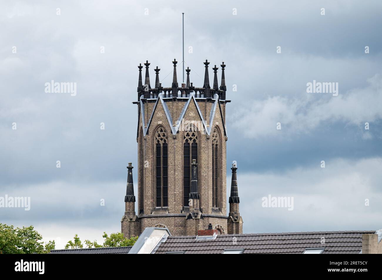 the distinctive steeple of the of the Herz-Jesu church in cologne-Mülheim without the steeple hood which was destroyed in ww2 and not rebuilt Stock Photo