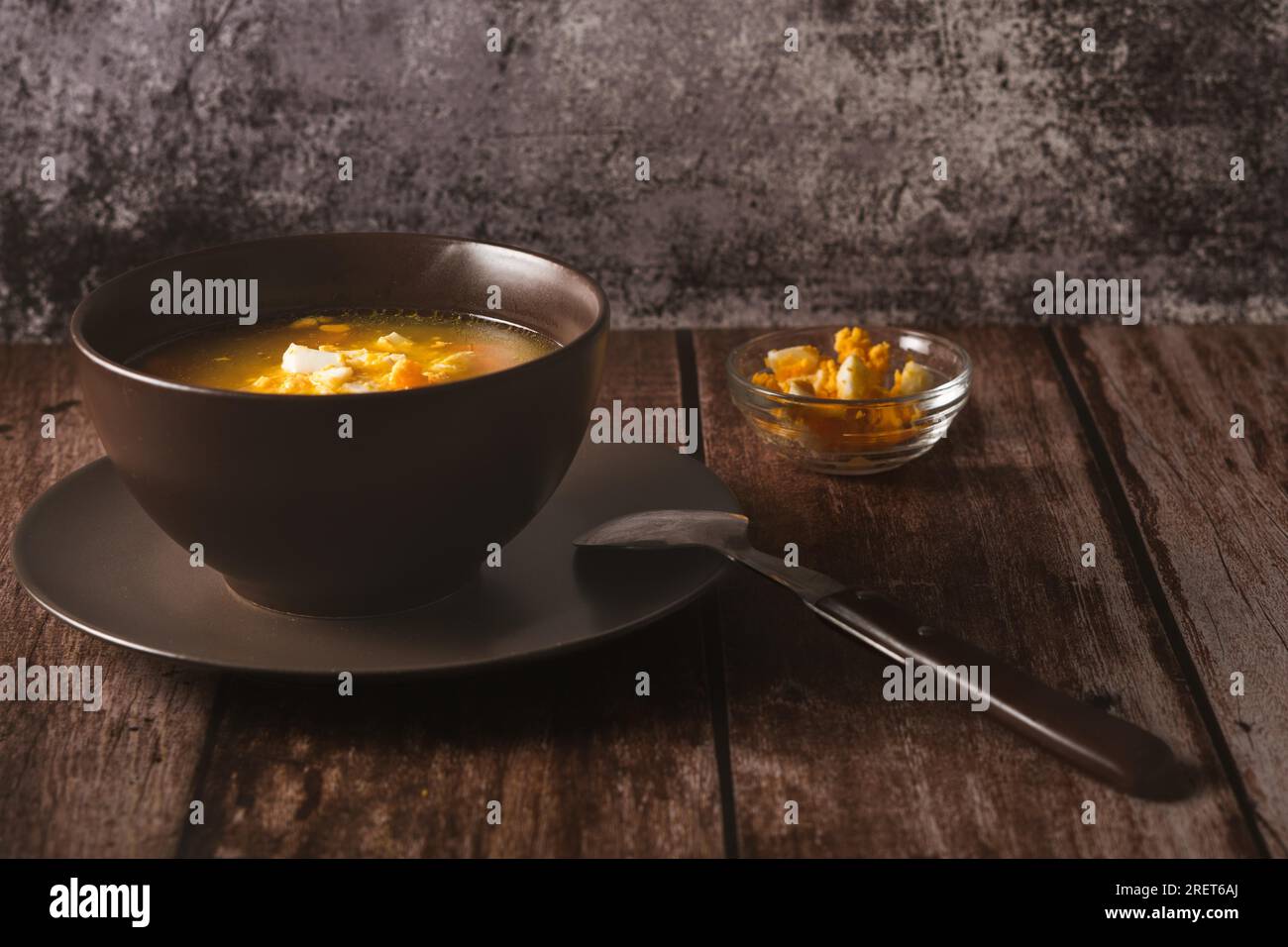 Bowl with chicken noodle soup and bowl with hardboiled egg Stock Photo Alamy
