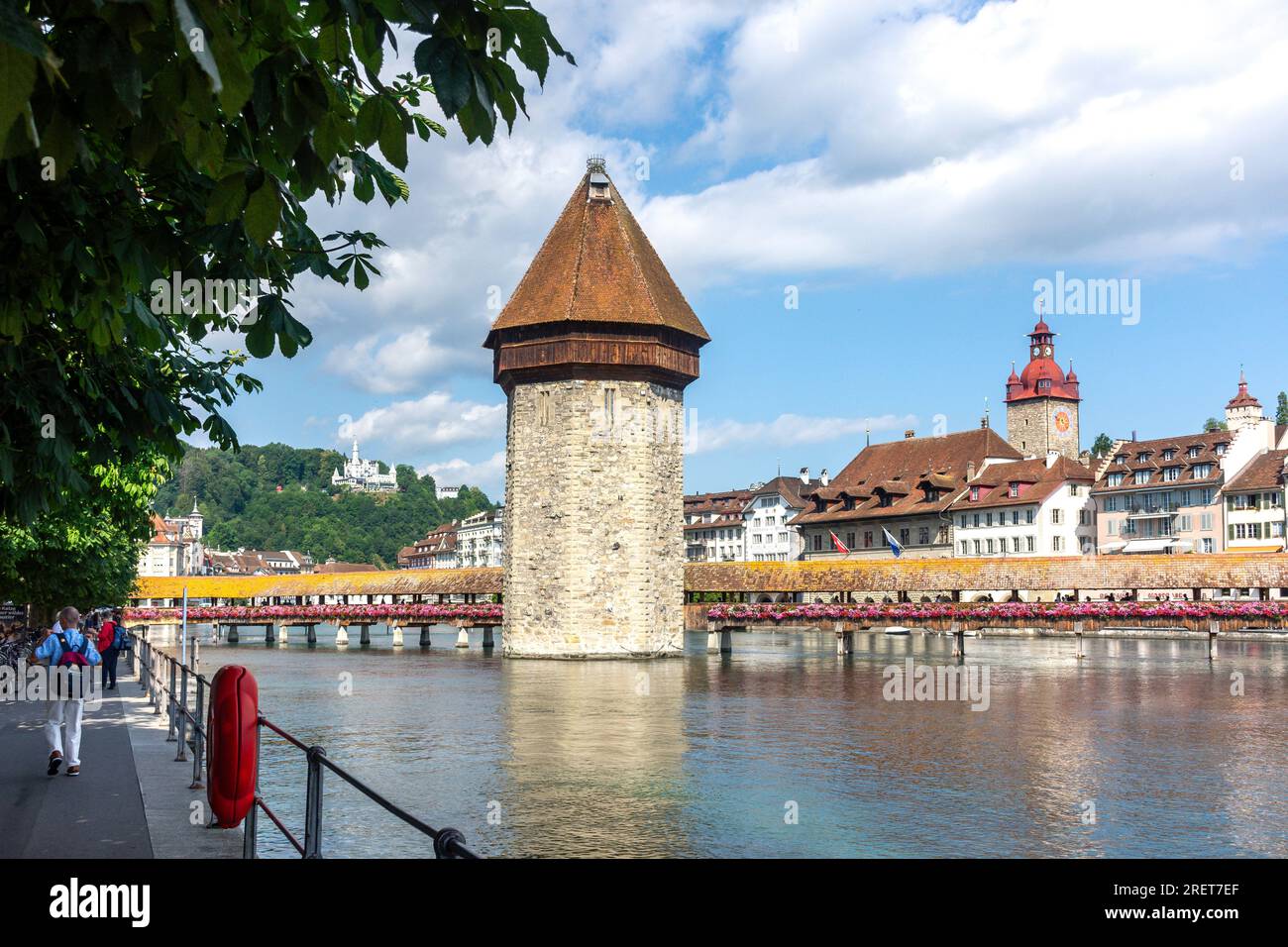 Town Hall Clock Tower and The Kapellbrücke (Chapel Bridge) across River Reuss, City of Lucerne (Luzern), Lucerne, Switzerland Stock Photo