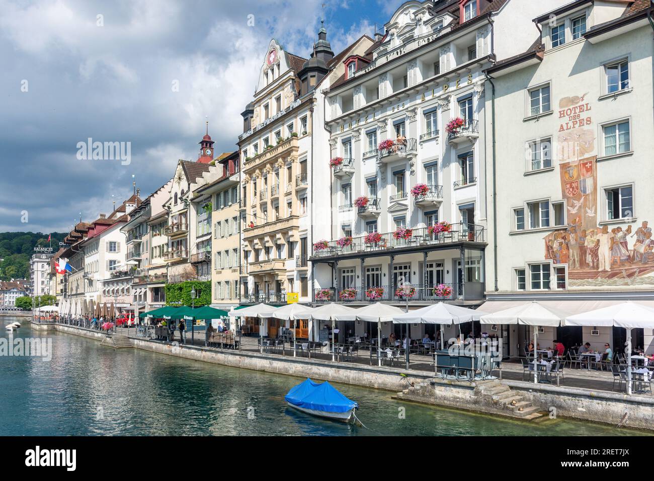 Town Hall Clock Tower and riverside buildings from The Kapellbrücke (Chapel Bridge), City of Lucerne (Luzern), Lucerne, Switzerland Stock Photo