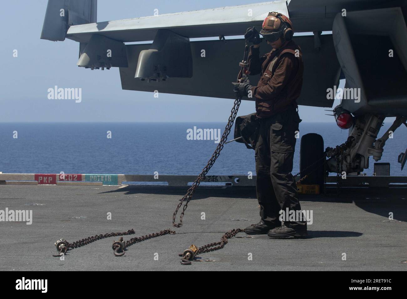 Aviation Structural Mechanic Airman Jacob Ward, from Lakeland, Florida, assigned to the "Golden
