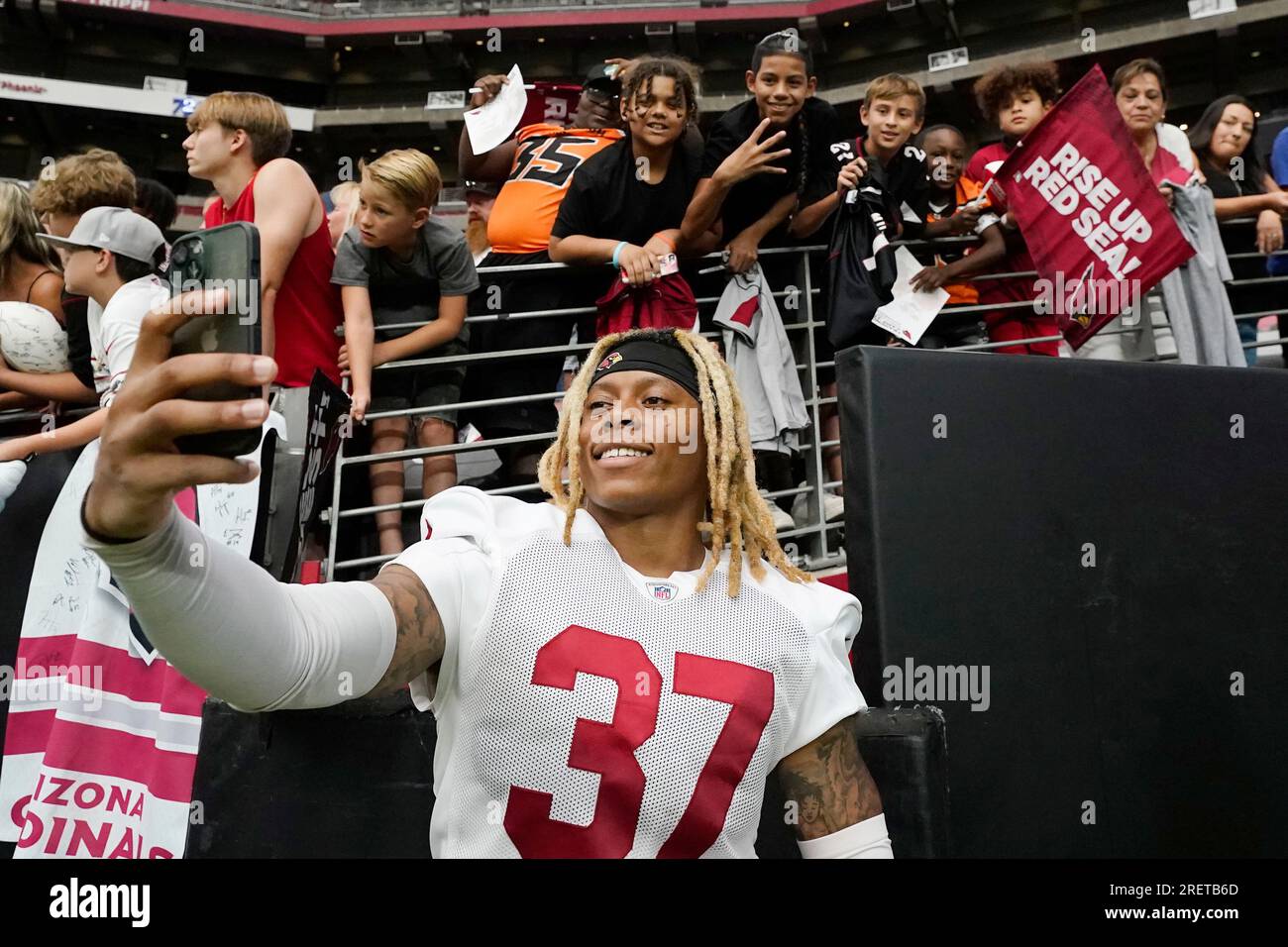 Arizona Cardinals cornerback Quavian White takes a selfie with fans after  NFL football training camp practice as part of Back Together Weekend at  State Farm Stadium Saturday, July 29, 2023, in Glendale,