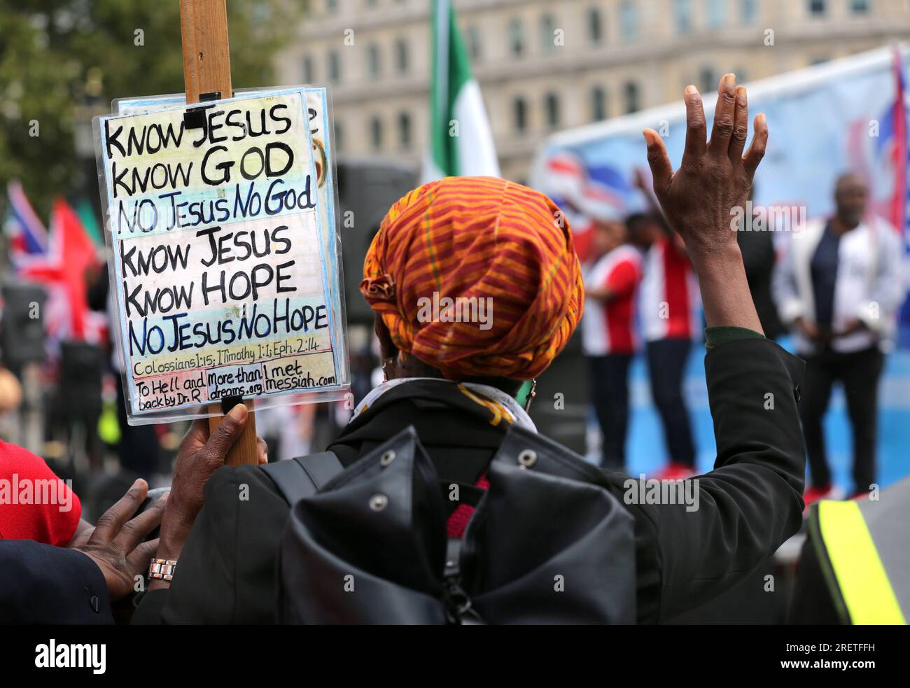 London UK 29th July 2023 A Worshiper Listens To A Speaker With A london-uk-29th-july-2023-a-worshiper-listens-to-a-speaker-with-a