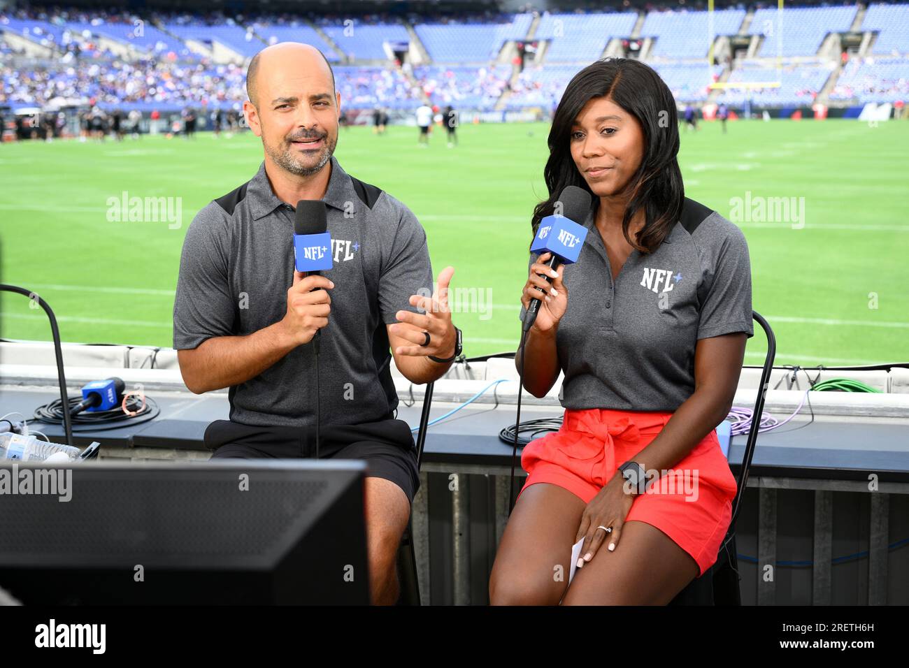 NFL Network reporters Mike Garafolo, left, and Sherree Burruss, right,  report from Baltimore Ravens NFL football training camp, Saturday, July 29,  2023, in Baltimore. (AP Photo/Nick Wass Stock Photo - Alamy