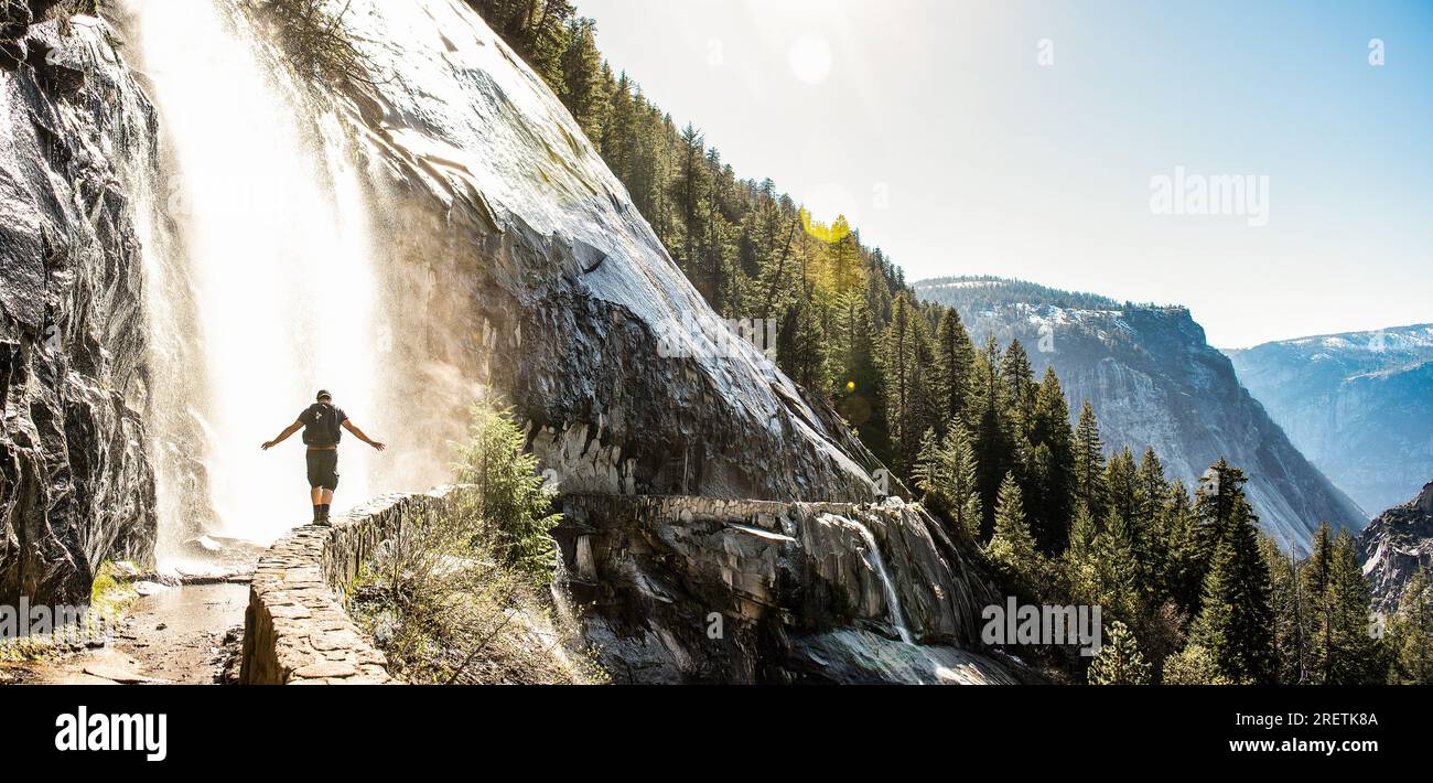 Hiker embracing adventure on the John Muir Trail in Yosemite. Stock Photo