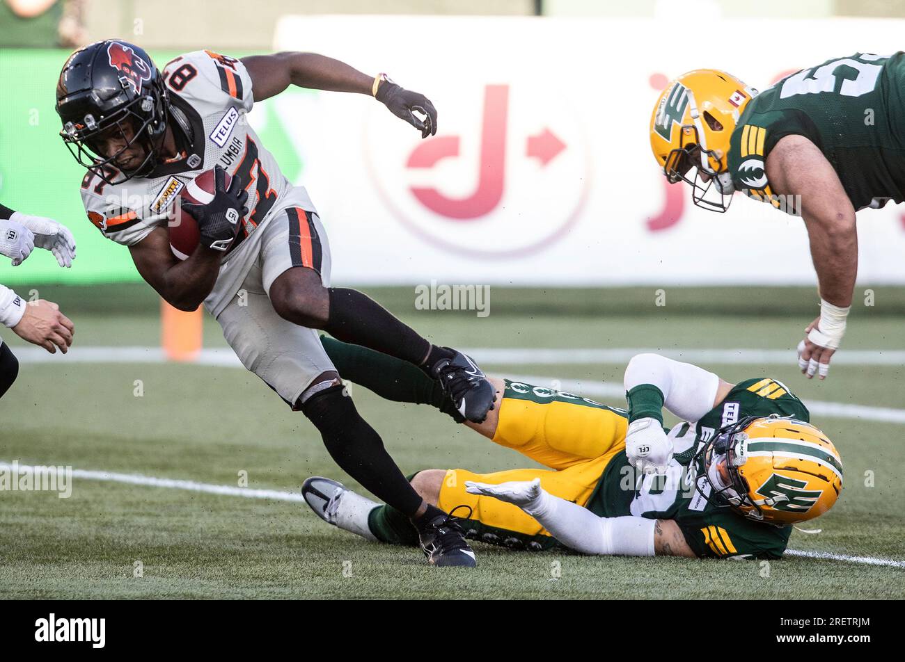 B.C. Lions' Terry Williams (87) slips a tackle from Edmonton Elks