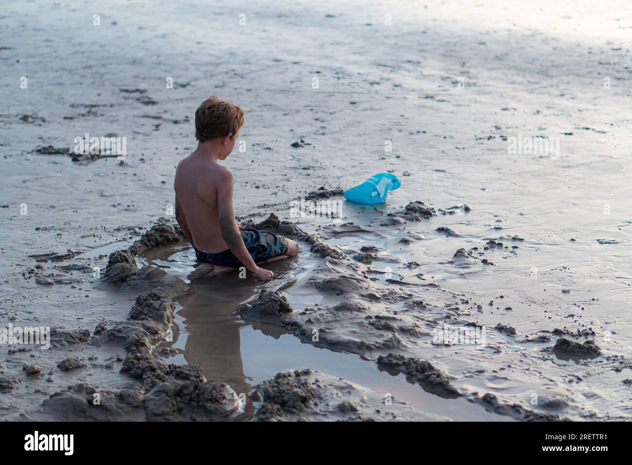Boy boat beach sunset hi-res stock photography and images - Alamy