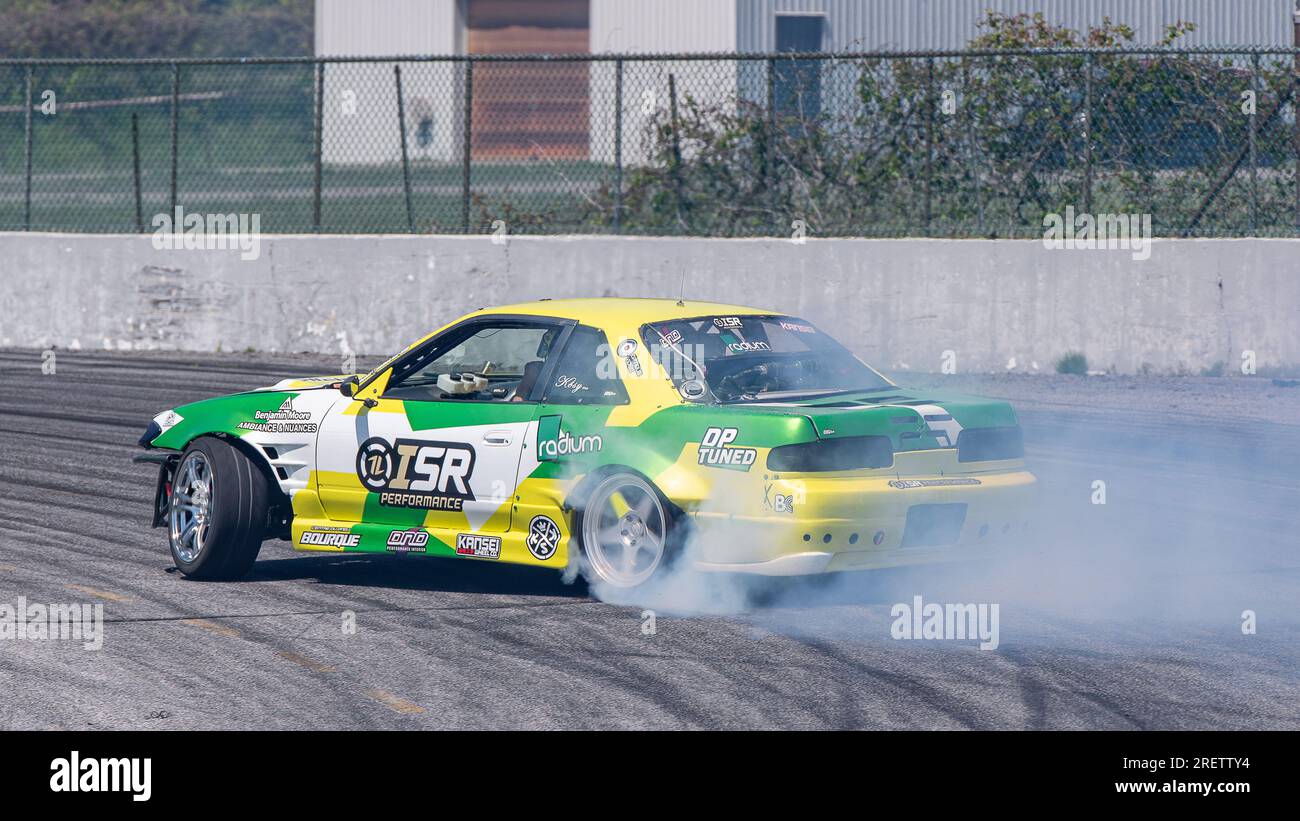 Car drifting auto racing event action with smoking tires - burning ...