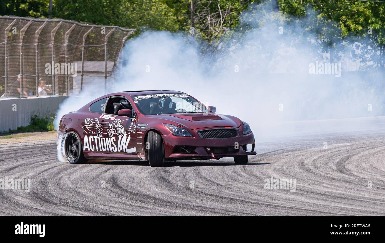 Car drifting auto racing event action with smoking tires - burning ...