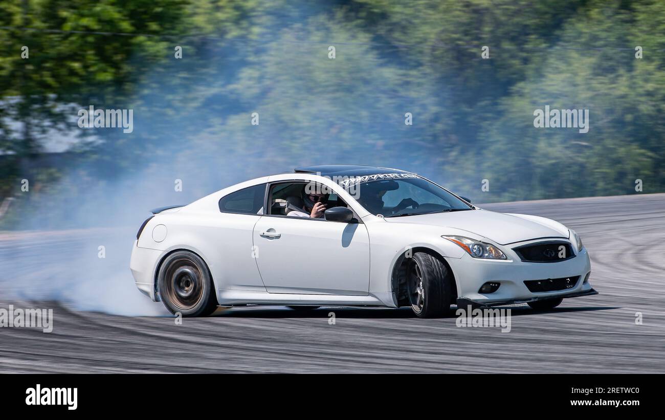 Car drifting auto racing event action with smoking tires - burning ...