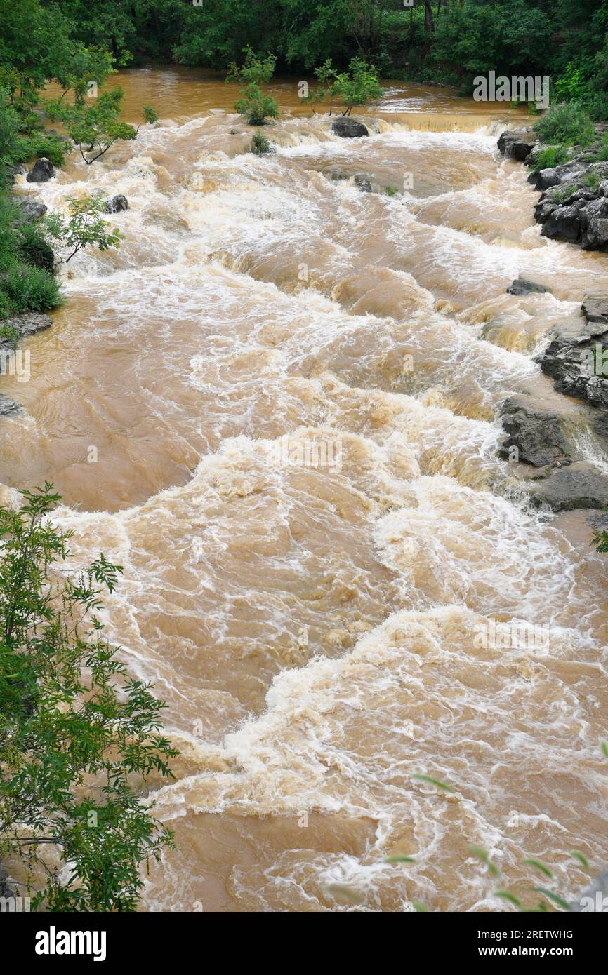 A flash flood caused by strong Typhoon 'Super Typhoon Doksuri' is seen in Zaozhuang city, Shandong province, China, July 30, 2023. Stock Photo