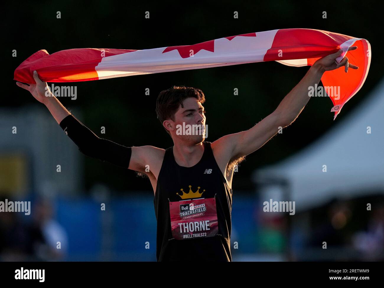 Craig Thorne celebrates with a Canadian flag after winning the men's
