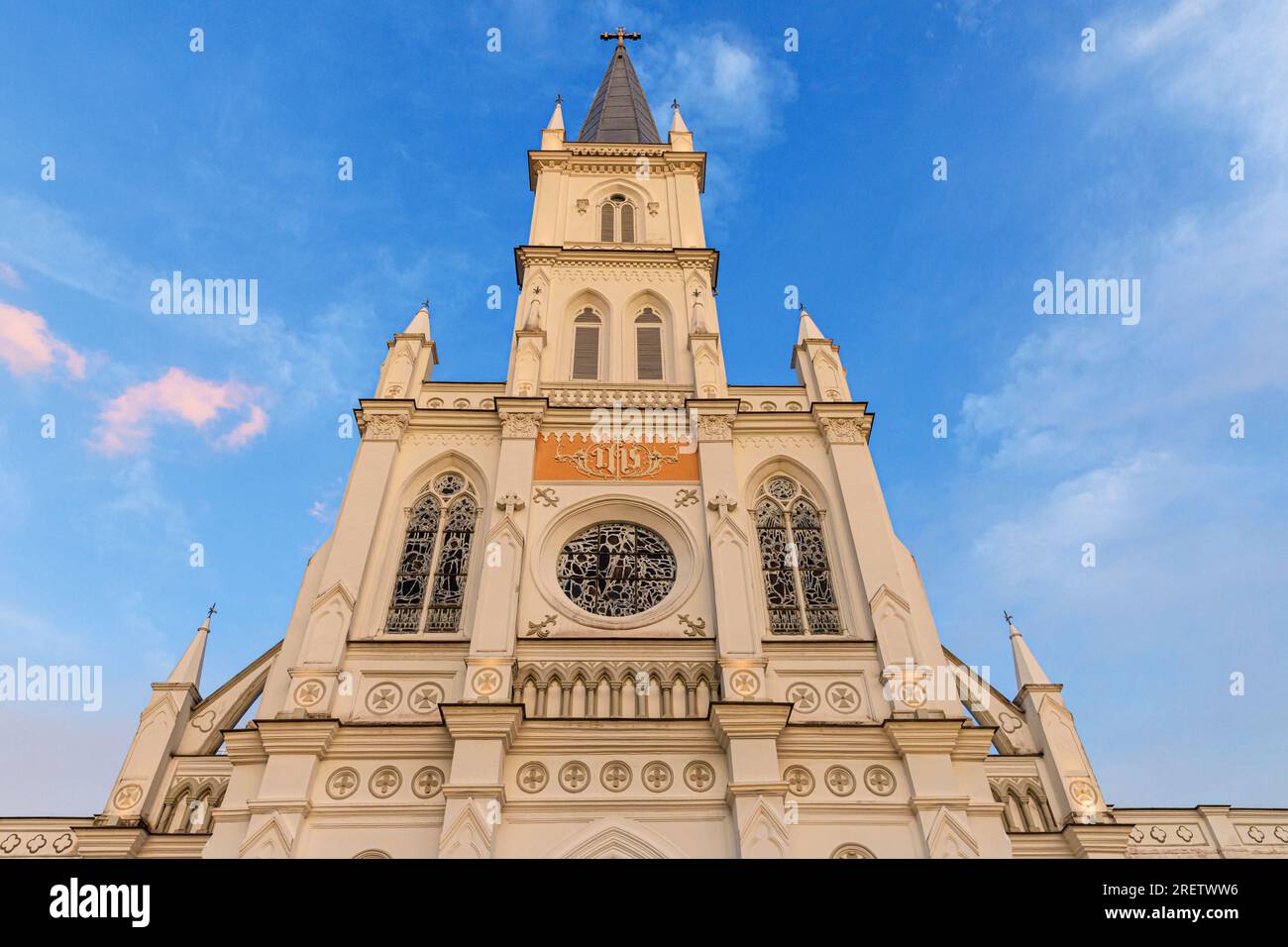 Steeple and spire of old Gothic style church, now CHIJMES Hall, CHIJMES complex, Singapore Stock Photo