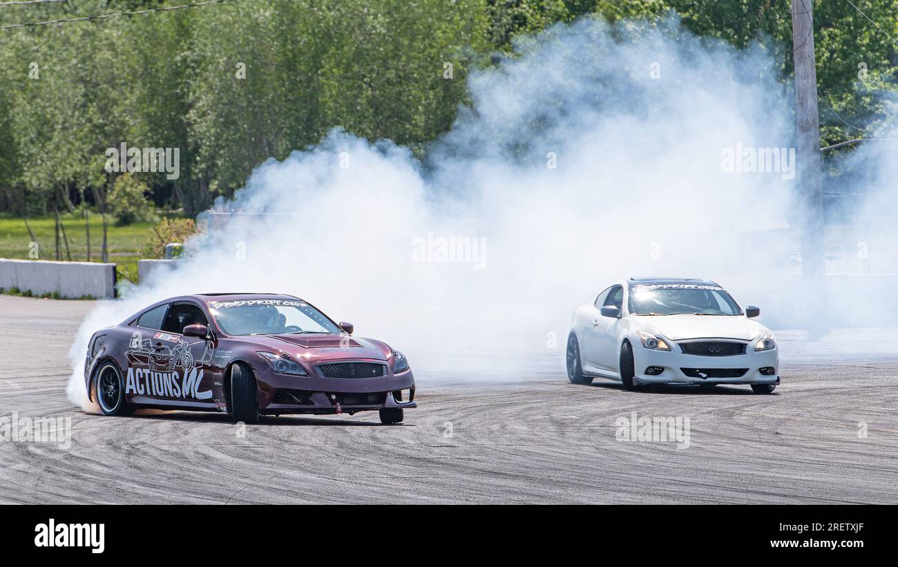 Car drifting auto racing event action with smoking tires - burning ...