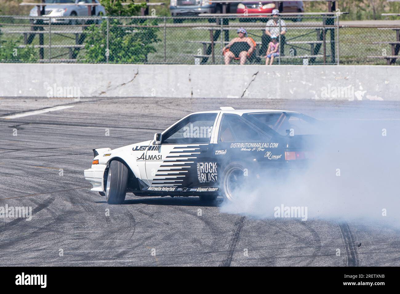 Car drifting auto racing event action with smoking tires - burning ...