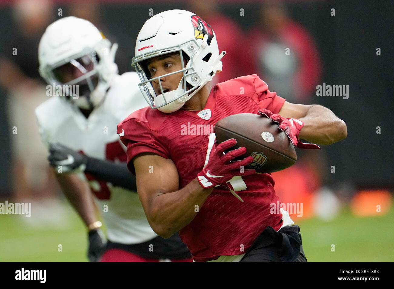 Arizona Cardinals wide receiver Rondale Moore, right, runs with