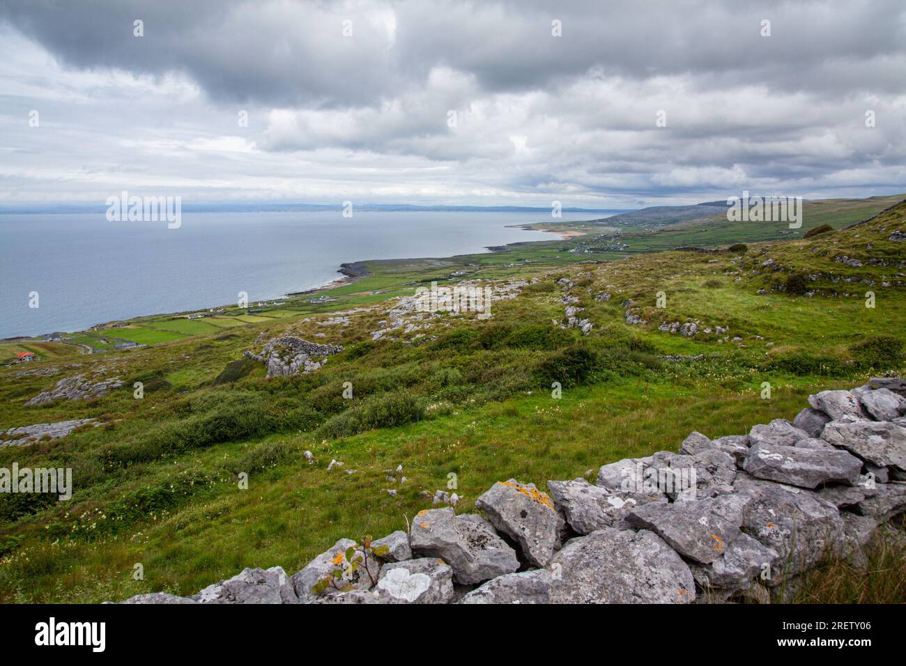 View of Fanore Beach and road to Galway from a vantage point high in the Burren. This photo was taken by myself at the end of July 2022, Stock Photo