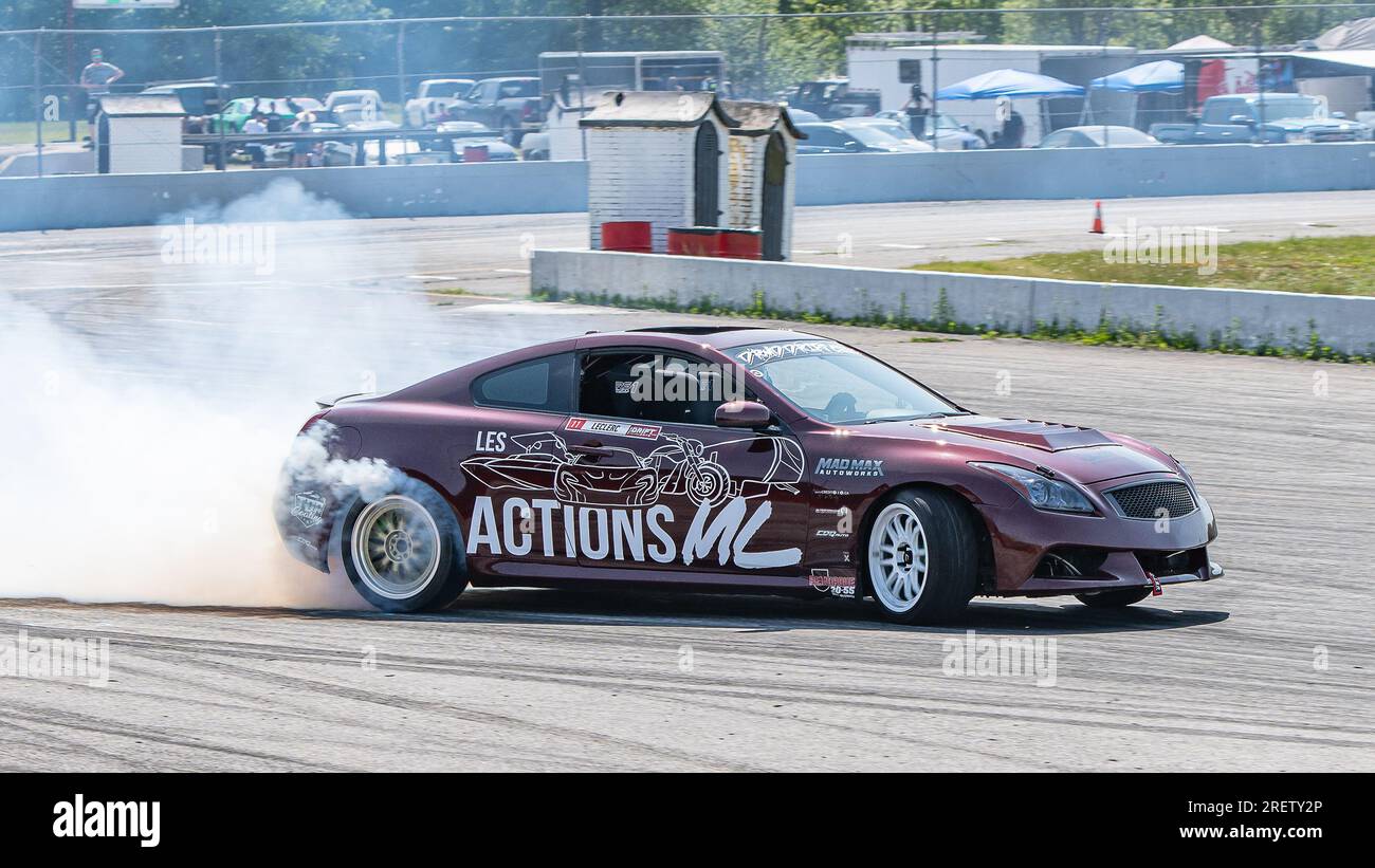 Car drifting auto racing event action with smoking tires - burning ...