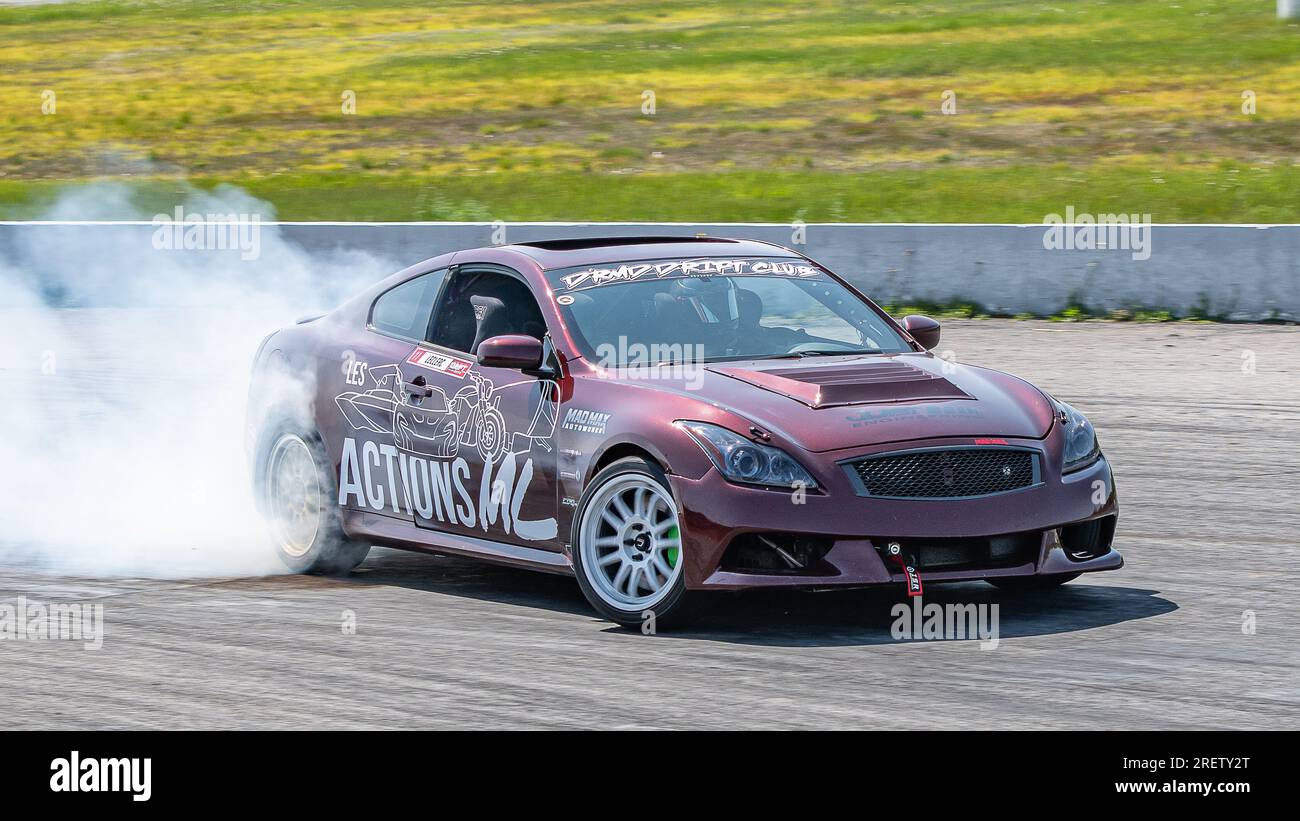 Car drifting auto racing event action with smoking tires - burning ...